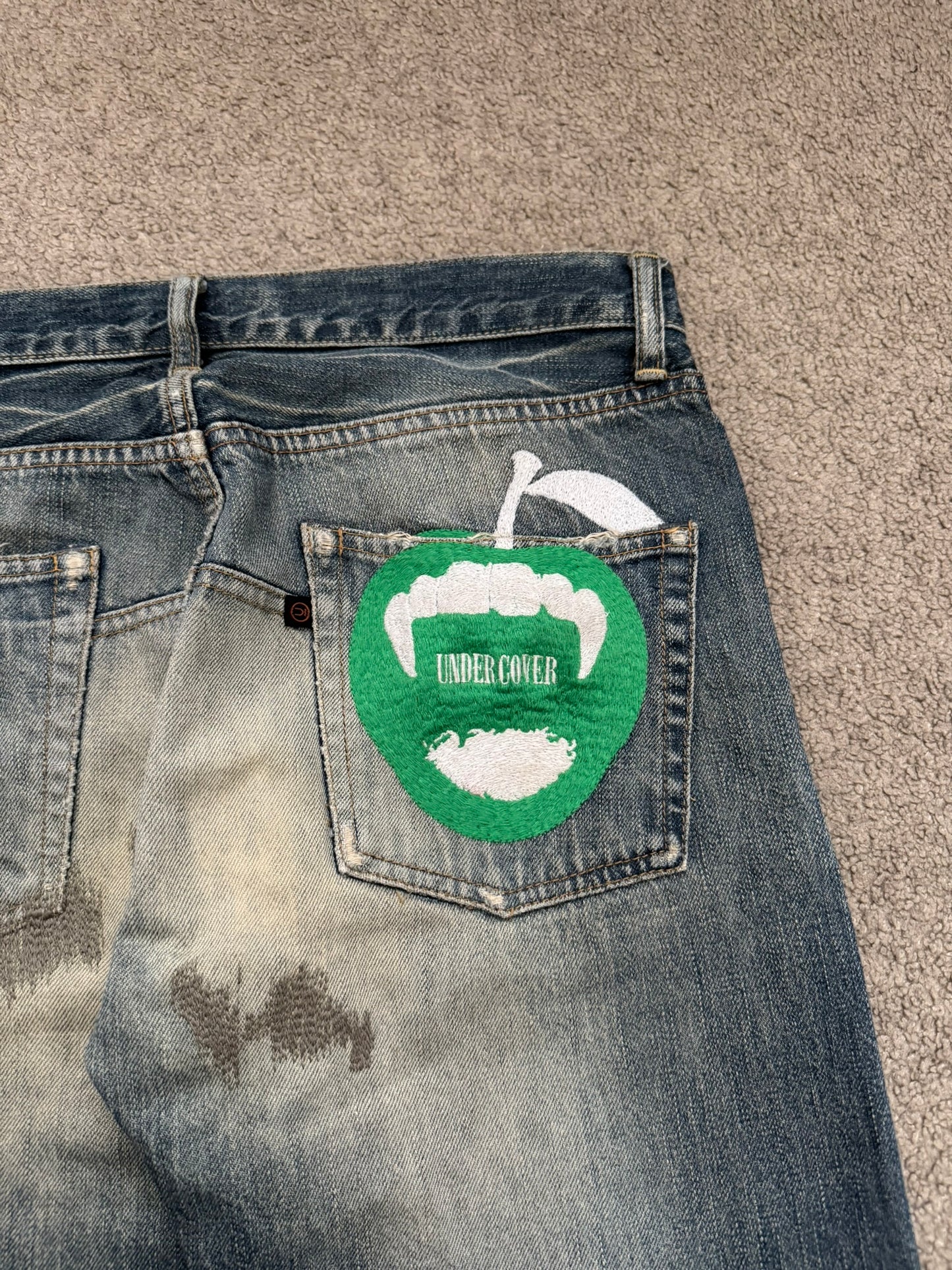AW07 Undercover "Knit" Apple Fang Embroidered Denim Jeans