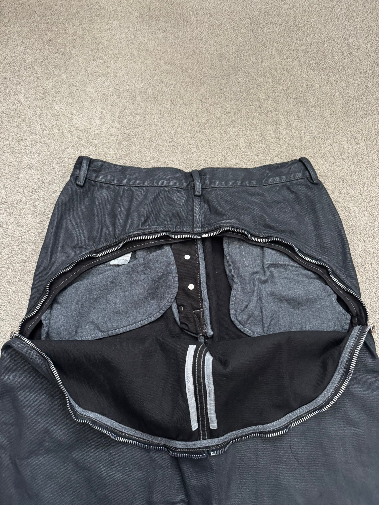 SS24 Rick Owens Mainline "Lido" Waxed Bolan Banana Cut Denim Jeans